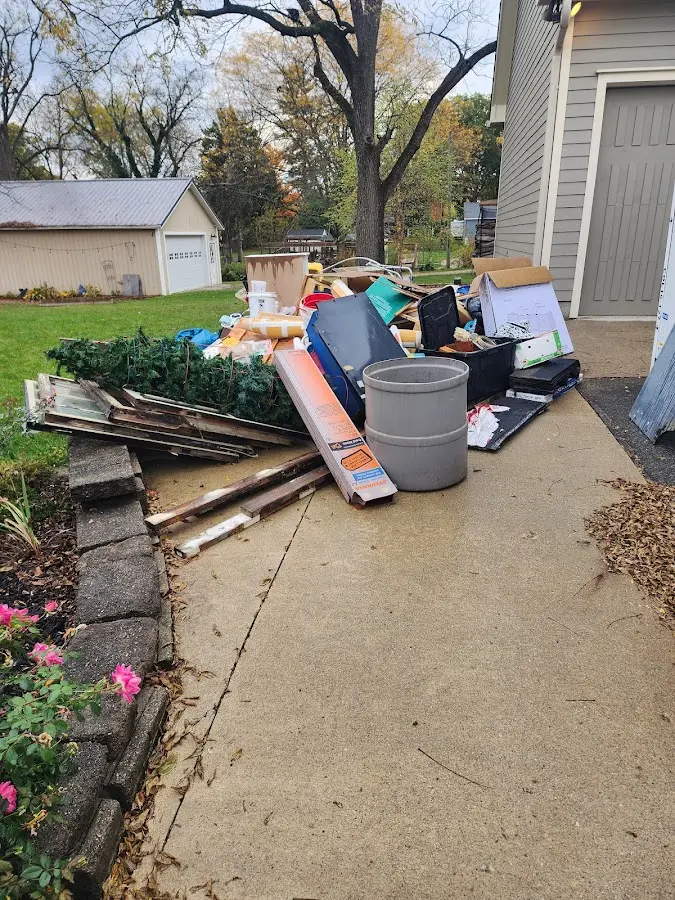 Dumpster being loaded with debris for Roofing Dumpster Rental in Royal Kunia
